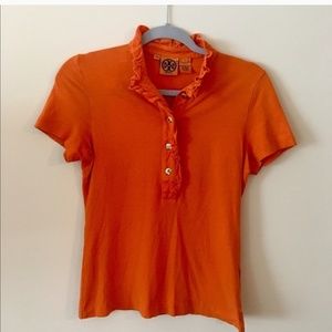 Tory Burch orange ruffled polo.